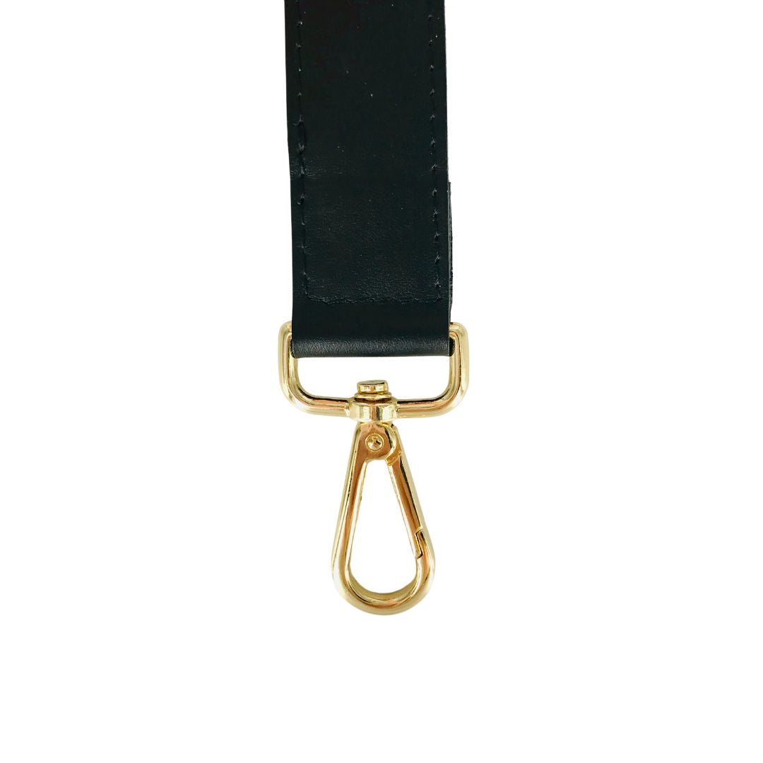 black leather bag strap with gold carabiner